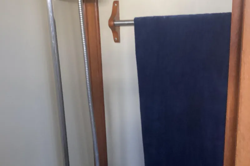 No Reservations Yacht Photos Pics Shower area in 1984 Spindrift 52 Motor Yacht with blue towel.