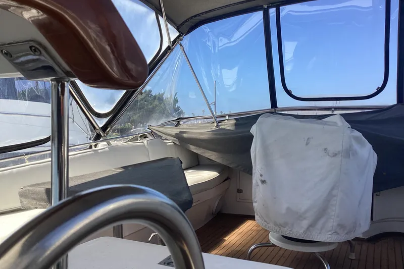 No Reservations Yacht Photos Pics Interior view of 1984 Spindrift 52 Motor Yacht, featuring helm and seating area.