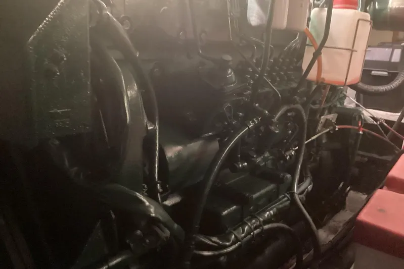 No Reservations Yacht Photos Pics Engine room of a 1984 Spindrift 52 Motor Yacht, showcasing mechanical components.