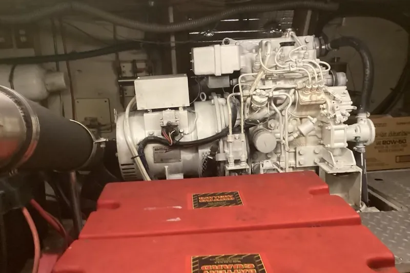 No Reservations Yacht Photos Pics Engine room of 1984 Spindrift 52 Motor Yacht with visible machinery and components.