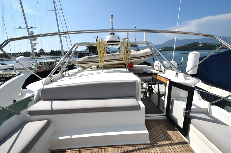 Odyssey Yacht Photos Pics Trader Sunliner 625 yacht, 2000 model, docked with open deck and scenic background.