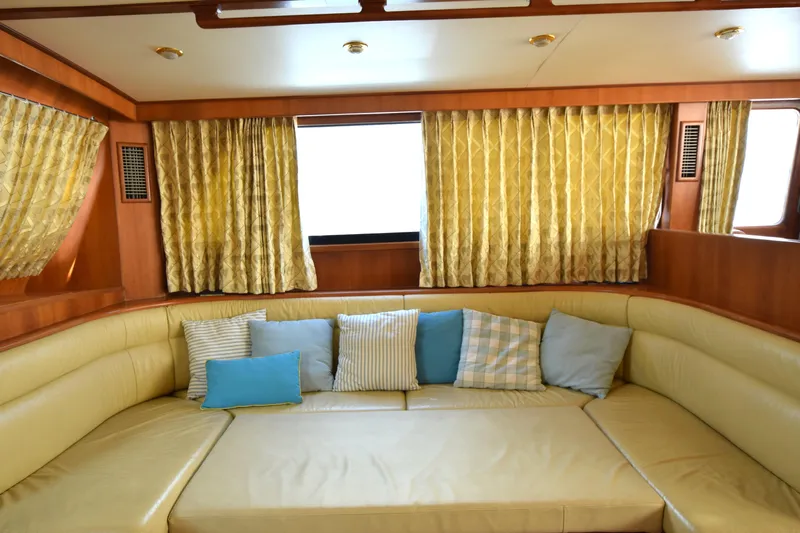 Odyssey Yacht Photos Pics Luxurious interior of 2000 Trader Sunliner 625 yacht with plush seating and decorative cushions.