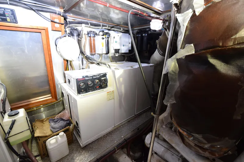 Odyssey Yacht Photos Pics Engine room of 2000 Trader Sunliner 625 with Onan Marine GenSet generator.
