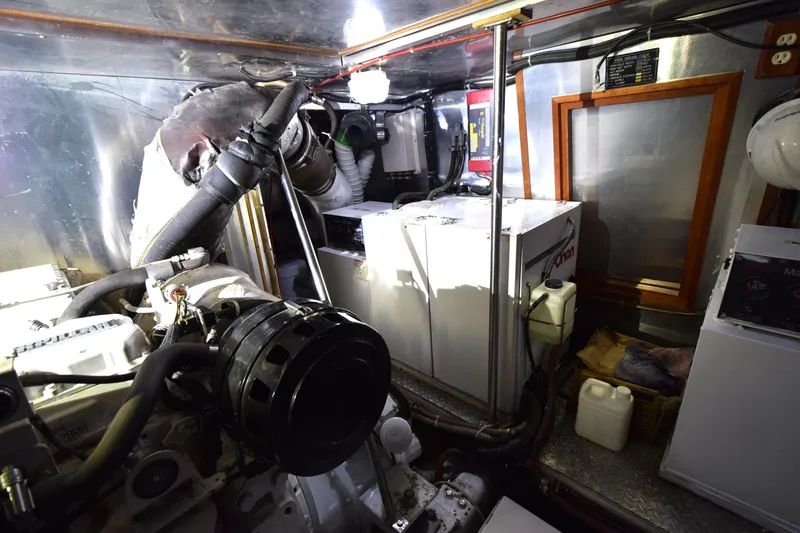 Odyssey Yacht Photos Pics Engine room of 2000 Trader Sunliner 625 yacht, featuring mechanical components and equipment.