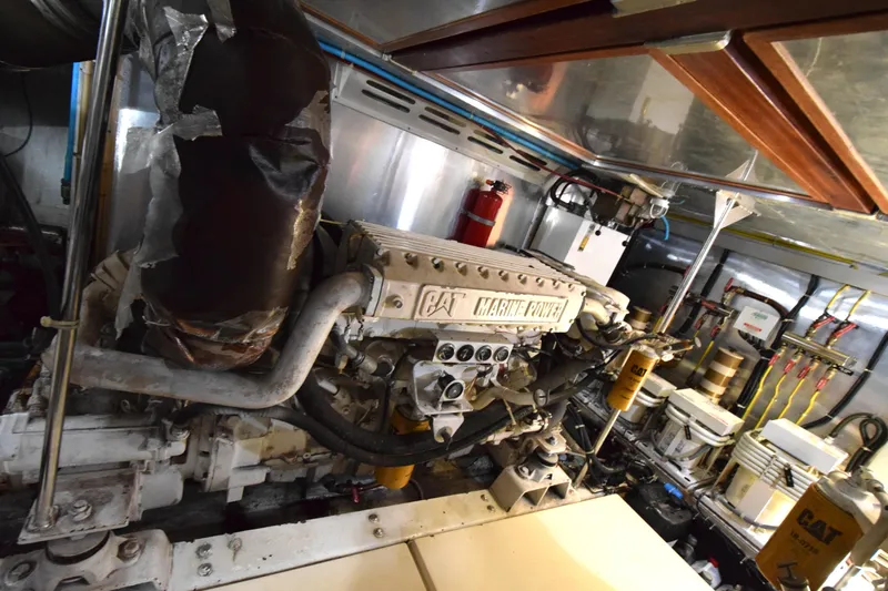 Odyssey Yacht Photos Pics Engine room of 2000 Trader Sunliner 625 yacht with CAT Marine Power engine.