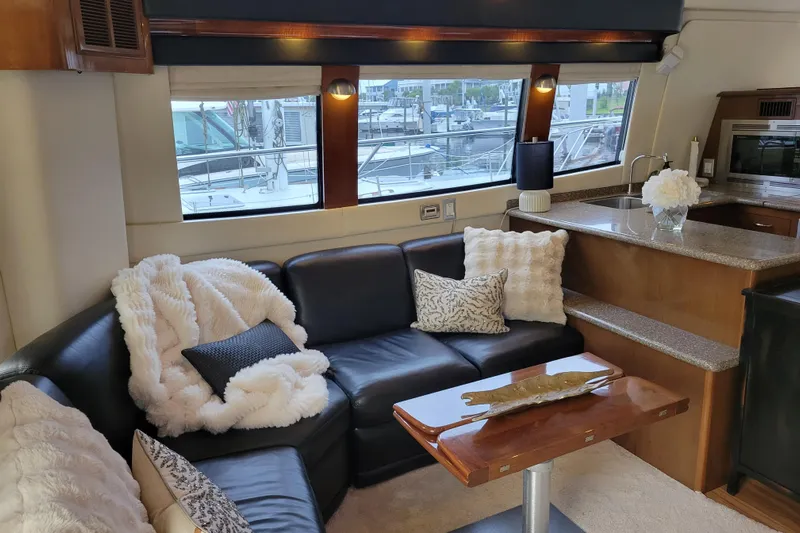  Yacht Photos Pics Luxurious interior of 2007 Carver 56 Voyager SE yacht with plush seating and elegant decor.