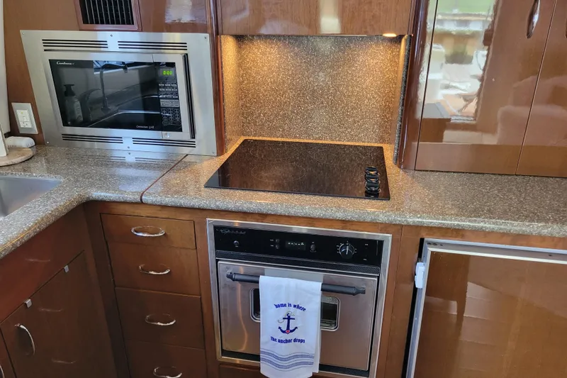  Yacht Photos Pics 2007 Carver 56 Voyager SE kitchen with microwave, stovetop, and oven.