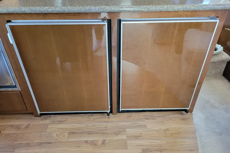  Yacht Photos Pics Wooden cabinet doors inside a 2007 Carver 56 Voyager SE yacht interior.