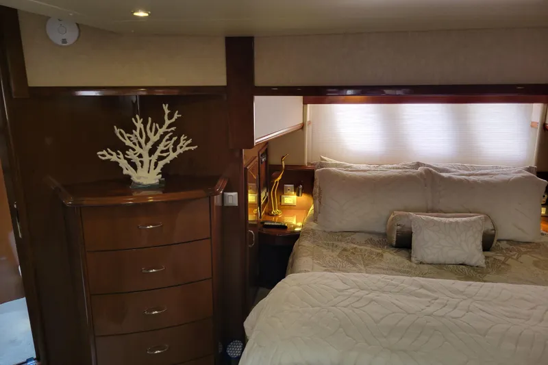  Yacht Photos Pics Luxurious bedroom interior of 2007 Carver 56 Voyager SE yacht with elegant decor.