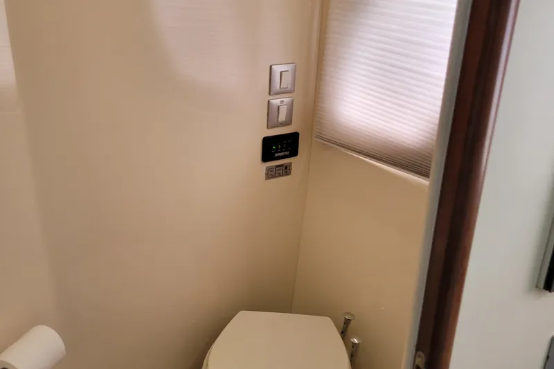  Yacht Photos Pics 2007 Carver 56 Voyager SE bathroom with modern fixtures and window shade.