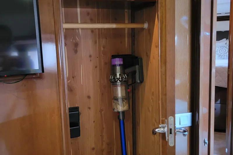  Yacht Photos Pics Wooden closet in 2007 Carver 56 Voyager SE with mounted vacuum cleaner.
