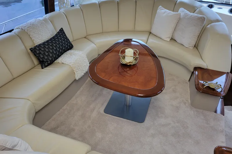  Yacht Photos Pics Luxurious interior of 2007 Carver 56 Voyager SE yacht with plush seating and elegant table.