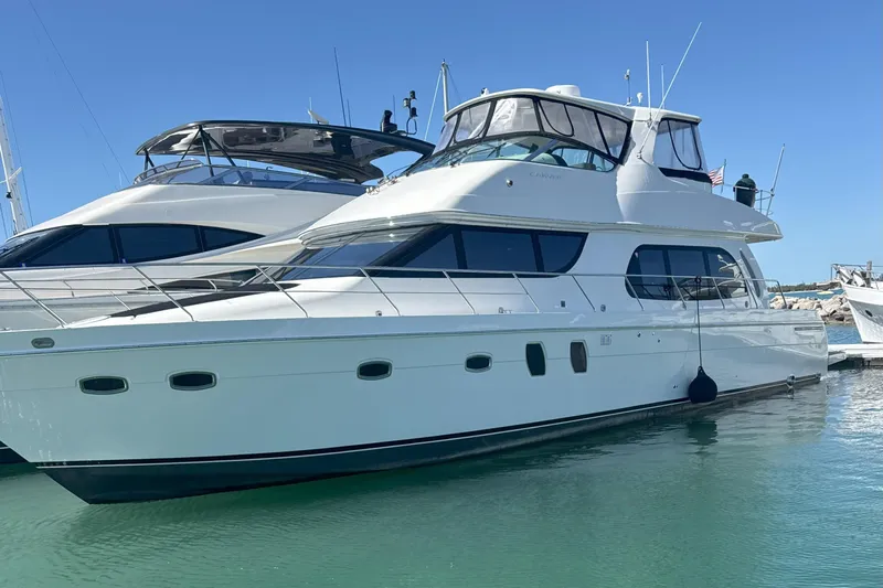  Yacht Photos Pics 2007 Carver 56 Voyager SE yacht docked in clear blue water.