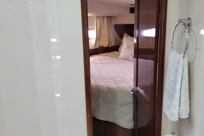  Yacht Photos Pics Luxurious bedroom interior of 2007 Carver 56 Voyager SE yacht with elegant bedding.