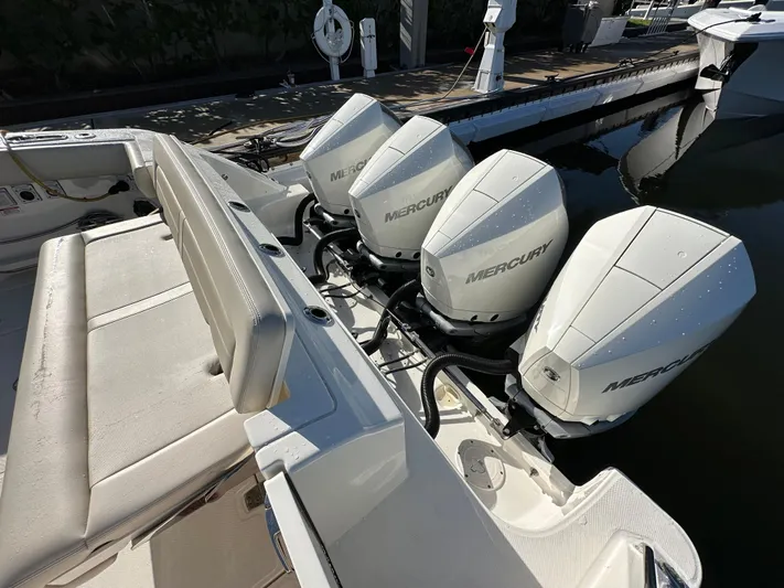 Hightide Yacht Photos Pics 2022 Boston Whaler 380 Realm with four Mercury outboard engines at dockside.