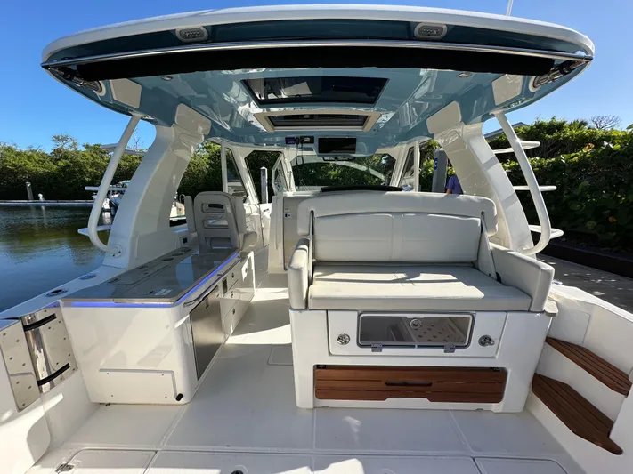 Hightide Yacht Photos Pics 2022 Boston Whaler 380 Realm interior with seating and modern amenities.