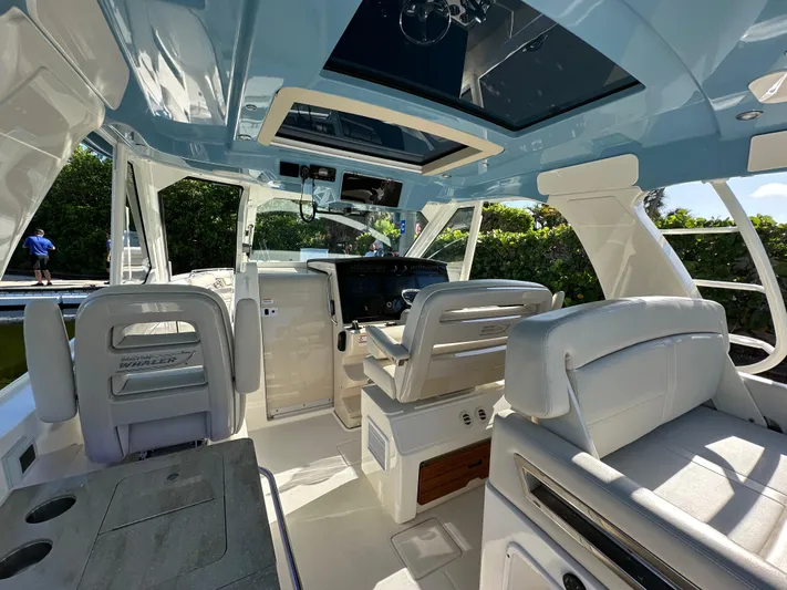 Hightide Yacht Photos Pics Interior of 2022 Boston Whaler 380 Realm, featuring luxurious seating and modern design.