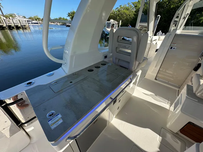 Hightide Yacht Photos Pics Boston Whaler 380 Realm 2022 boat interior with seating and water view.