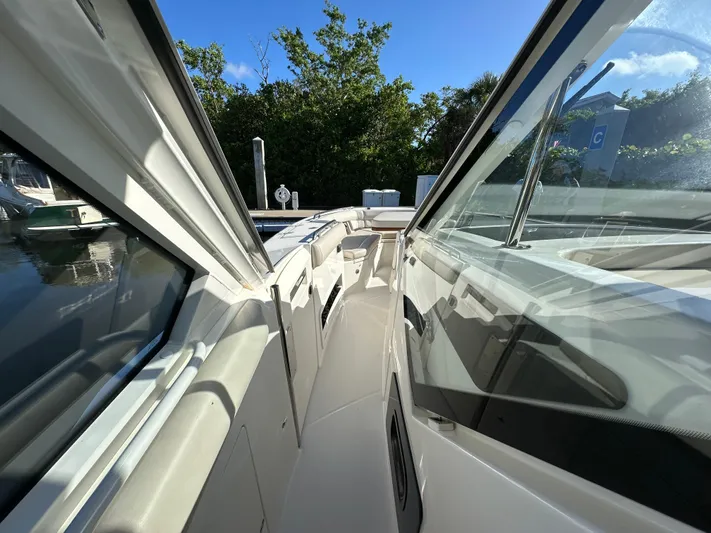 Hightide Yacht Photos Pics 2022 Boston Whaler 380 Realm boat deck with sleek design and clear skies.