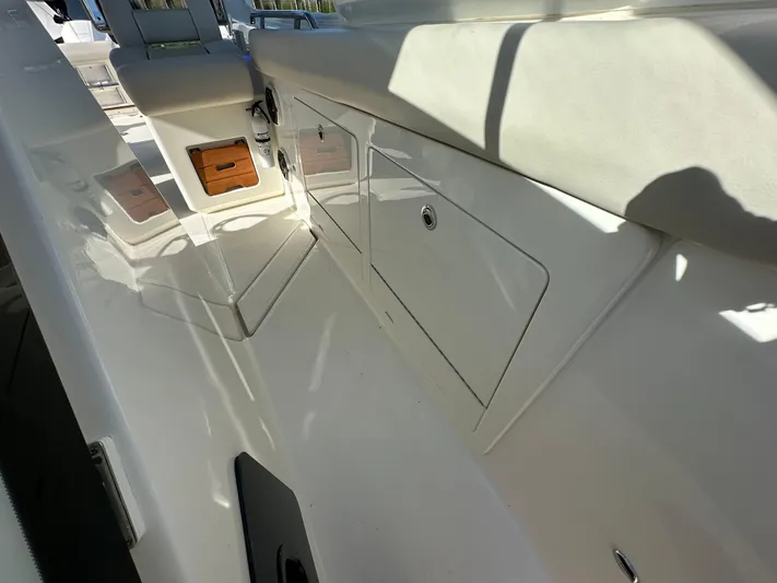 Hightide Yacht Photos Pics 2022 Boston Whaler 380 Realm interior with storage compartments and seating.