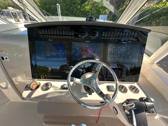 Hightide Yacht Photos Pics Control panel of a 2022 Boston Whaler 380 Realm with advanced navigation displays.