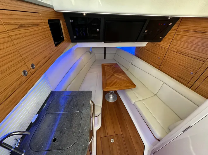 Hightide Yacht Photos Pics Luxurious interior of 2022 Boston Whaler 380 Realm with wood accents and modern amenities.