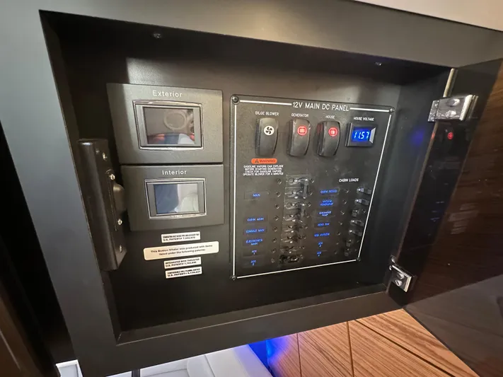 Hightide Yacht Photos Pics 12V main DC panel on 2022 Boston Whaler 380 Realm boat, showing switches and voltage display.