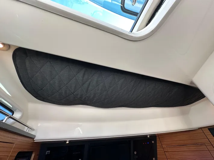 Hightide Yacht Photos Pics Interior view of 2022 Boston Whaler 380 Realm with quilted ceiling panel.