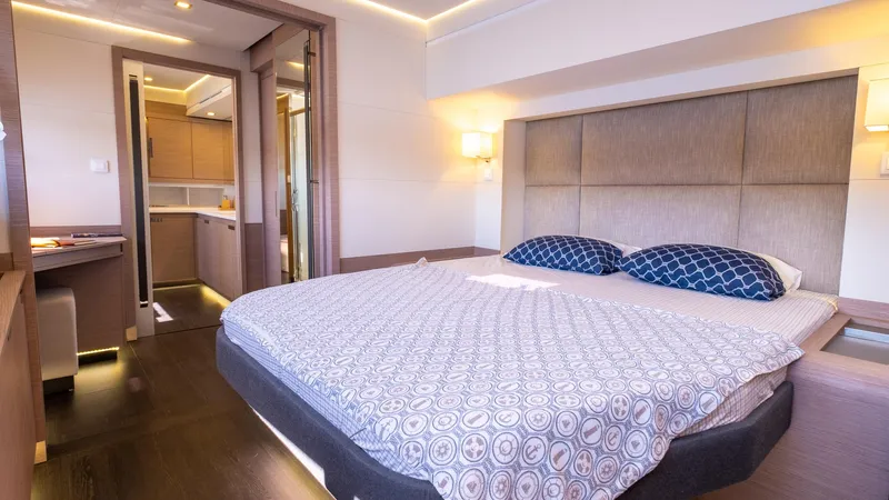  Yacht Photos Pics Luxurious bedroom in 2023 Fountaine Pajot Catamaran Alegria 67 with modern decor.