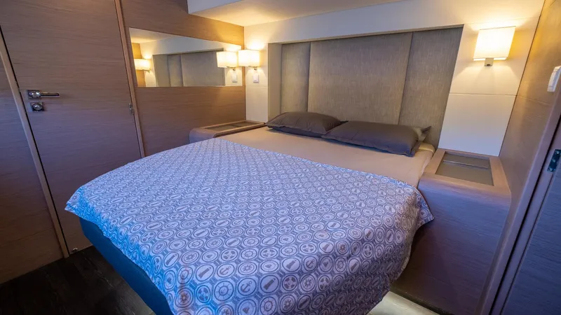  Yacht Photos Pics Luxurious bedroom interior of 2023 Fountaine Pajot Catamaran Alegria 67 with modern design.