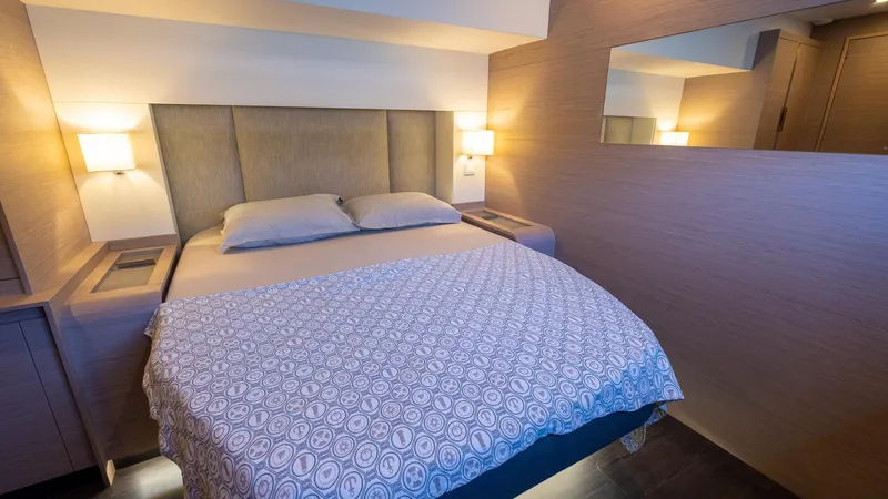  Yacht Photos Pics Luxurious bedroom interior of 2023 Fountaine Pajot Catamaran Alegria 67 with modern design.