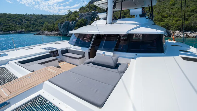  Yacht Photos Pics 2023 Fountaine Pajot Catamaran Alegria 67 with spacious deck and scenic ocean view.