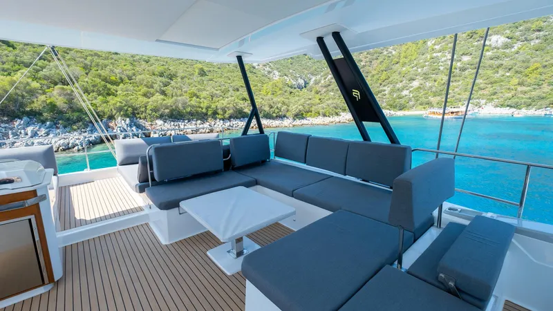  Yacht Photos Pics Luxurious 2023 Fountaine Pajot Catamaran Alegria 67 with spacious deck and scenic ocean view.