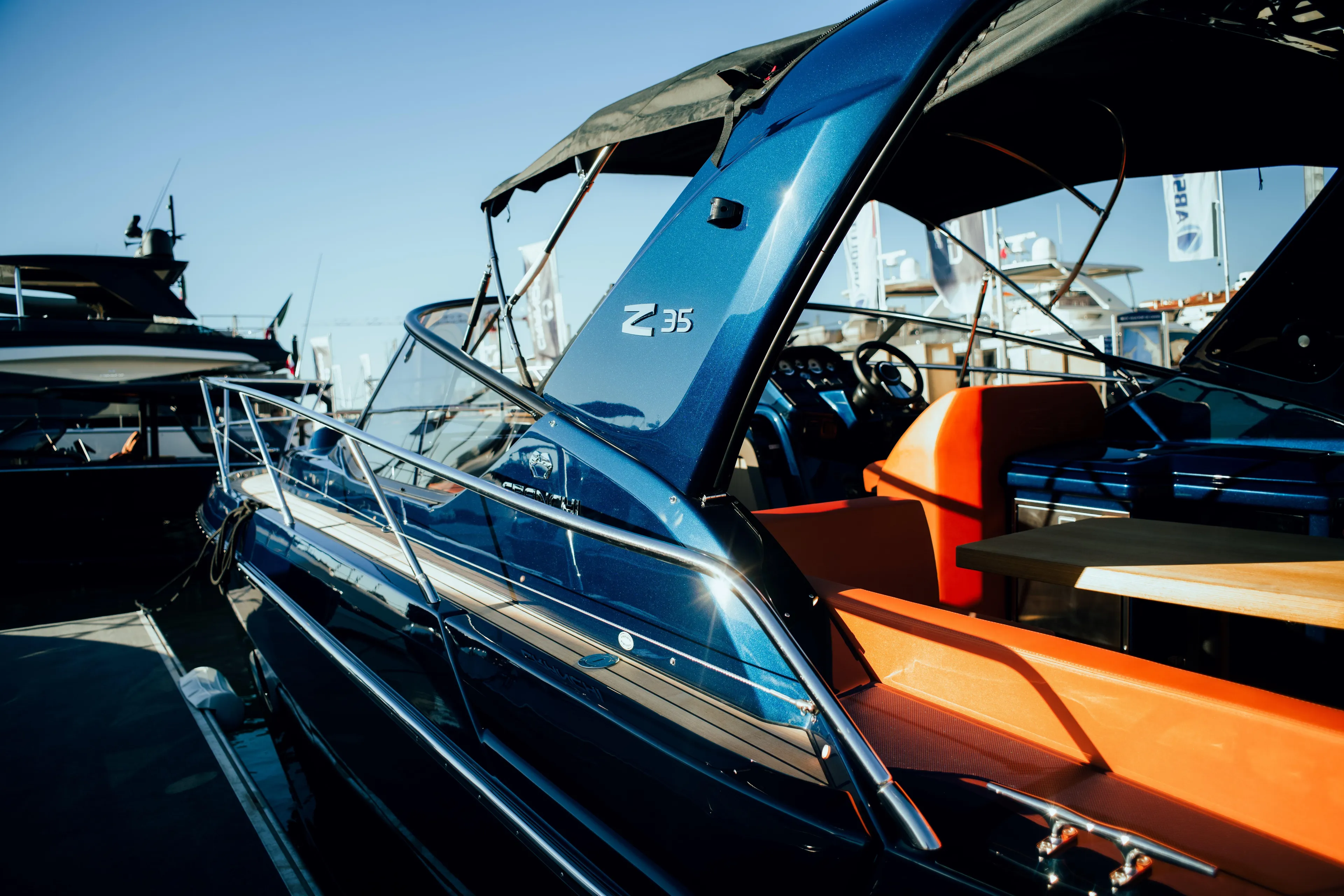  Yacht Photos Pics 2025 Cranchi Z35 yacht with sleek design and luxurious interior at a marina.