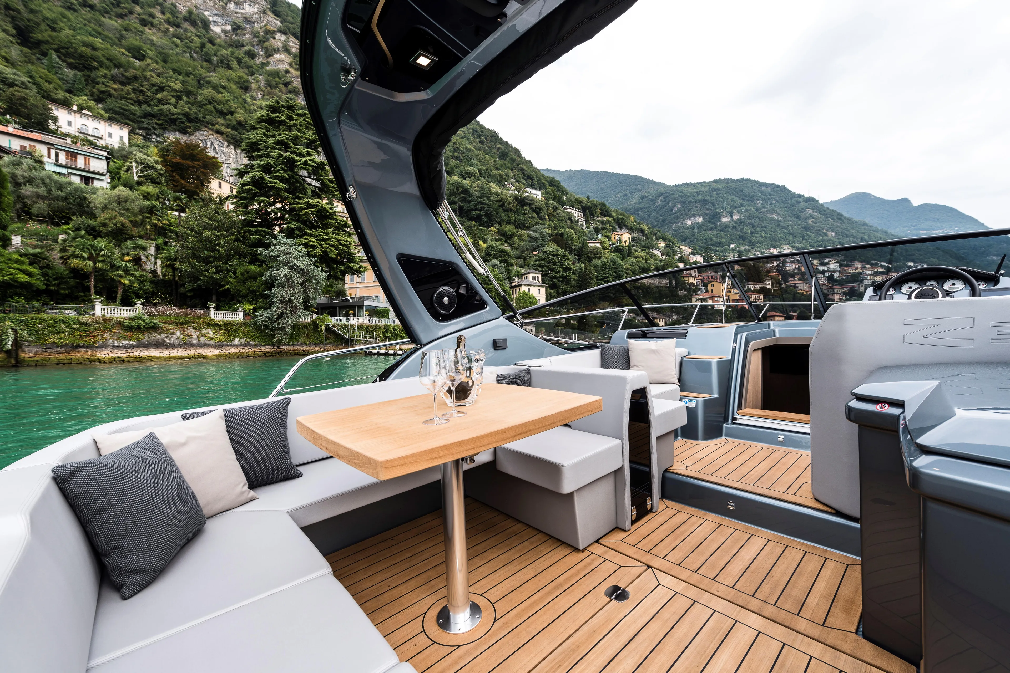  Yacht Photos Pics Luxurious 2025 Cranchi Z35 yacht interior with elegant seating and scenic waterfront view.