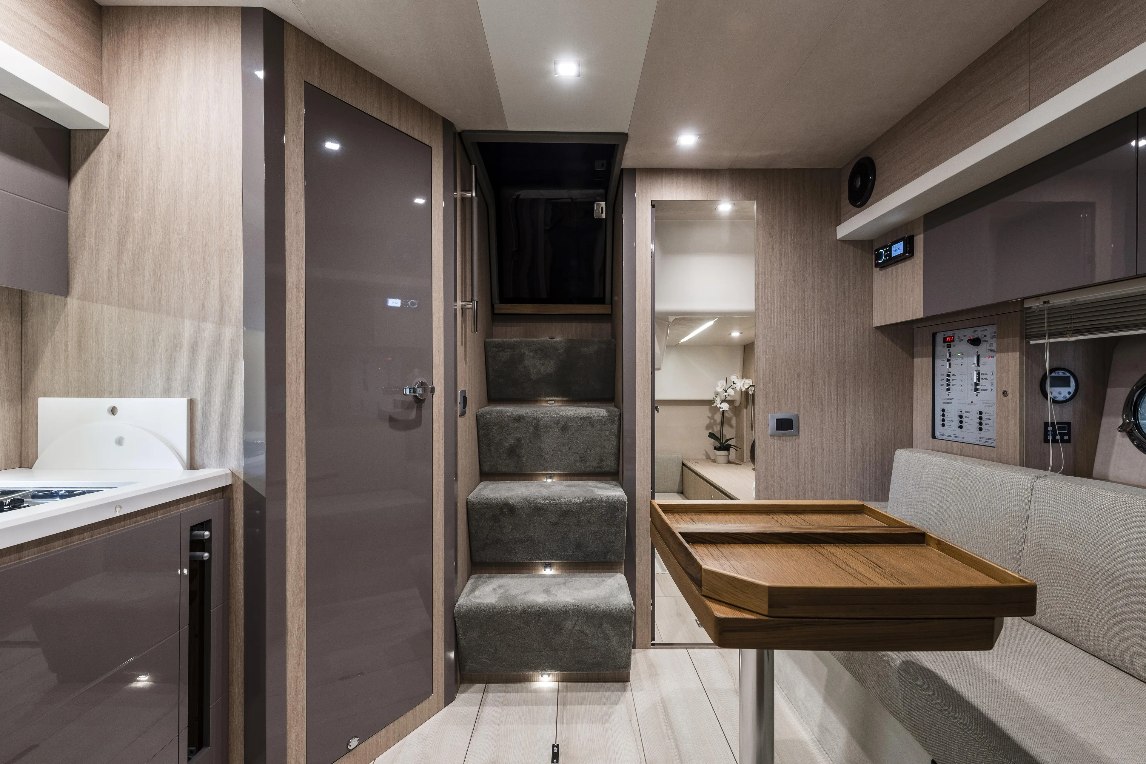  Yacht Photos Pics Interior of 2025 Cranchi Z35 yacht, featuring modern design with stairs and seating area.