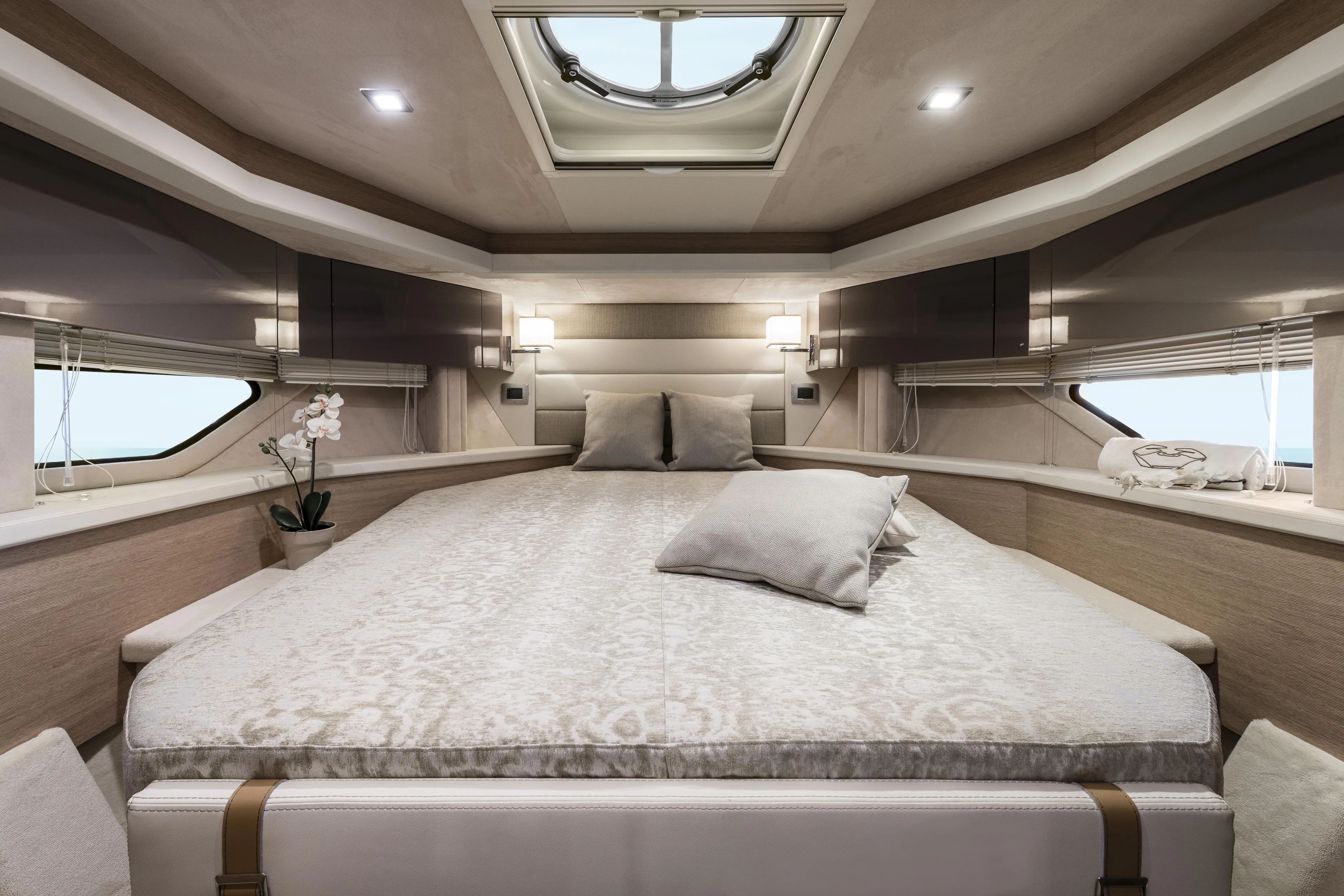  Yacht Photos Pics Luxurious interior of 2025 Cranchi Z35 yacht cabin with elegant bedding and decor.