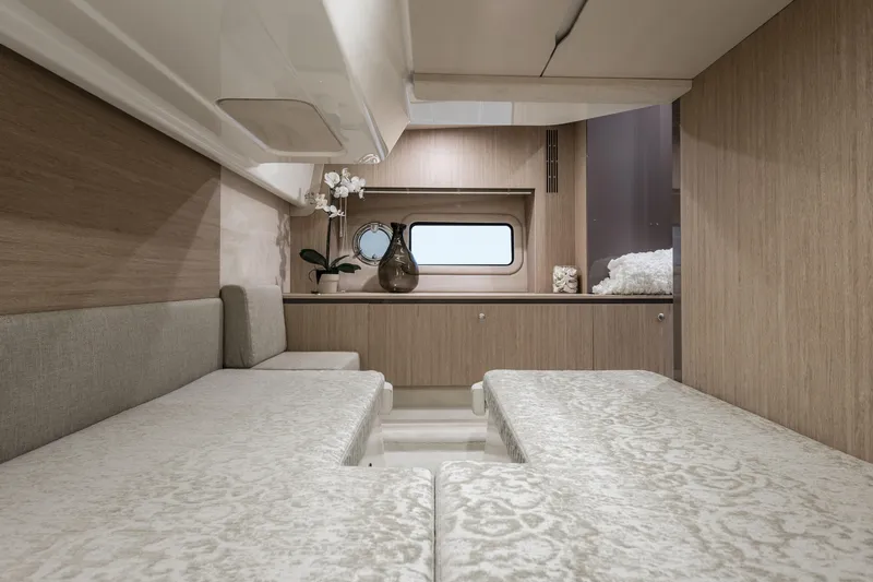  Yacht Photos Pics Luxurious interior of 2025 Cranchi Z35 yacht with elegant wood finishes and plush seating.