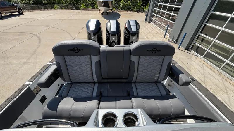  Yacht Photos Pics 2025 Fountain 34 SC boat interior with triple engines and luxurious seating.