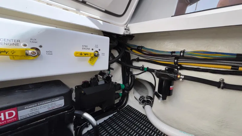  Yacht Photos Pics Engine compartment of 2025 Fountain 34 SC boat, showing fuel lines and power steering pump.