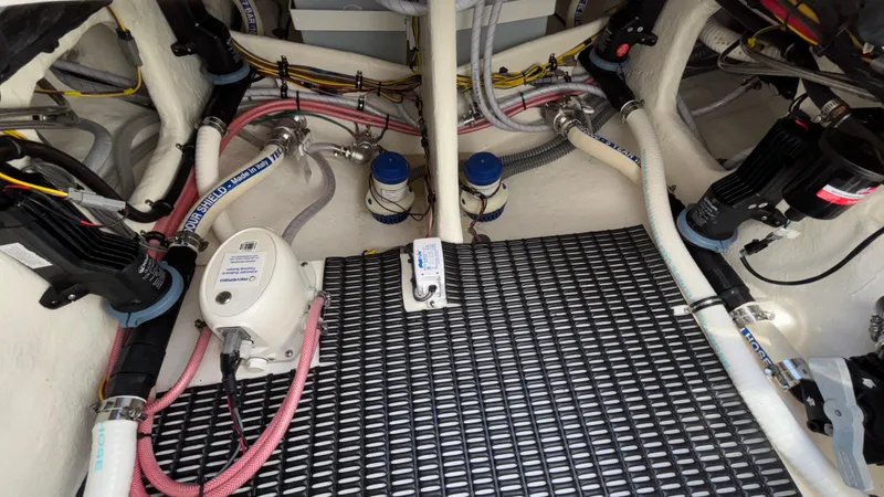  Yacht Photos Pics Engine compartment of 2025 Fountain 34 SC boat with visible hoses and equipment.