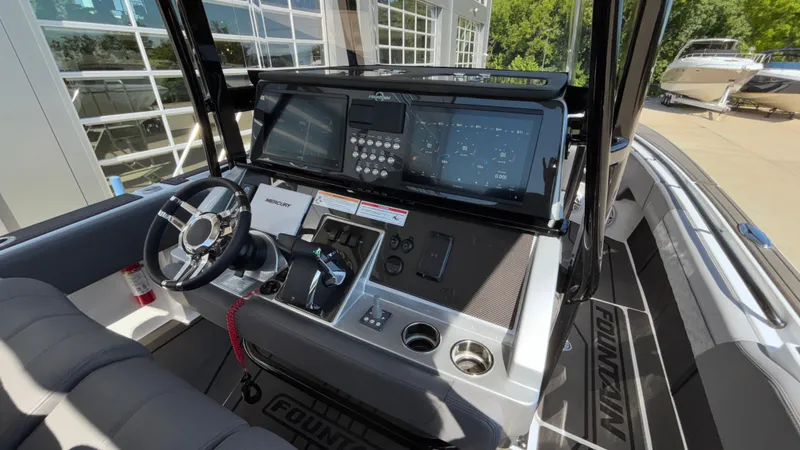  Yacht Photos Pics 2025 Fountain 34 SC boat dashboard with modern controls and navigation system.