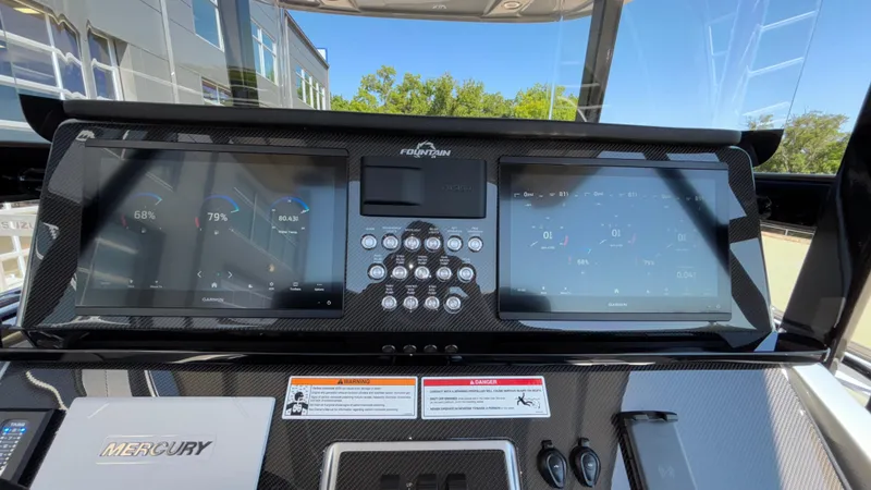  Yacht Photos Pics 2025 Fountain 34 SC dashboard with dual Garmin displays and Mercury controls.