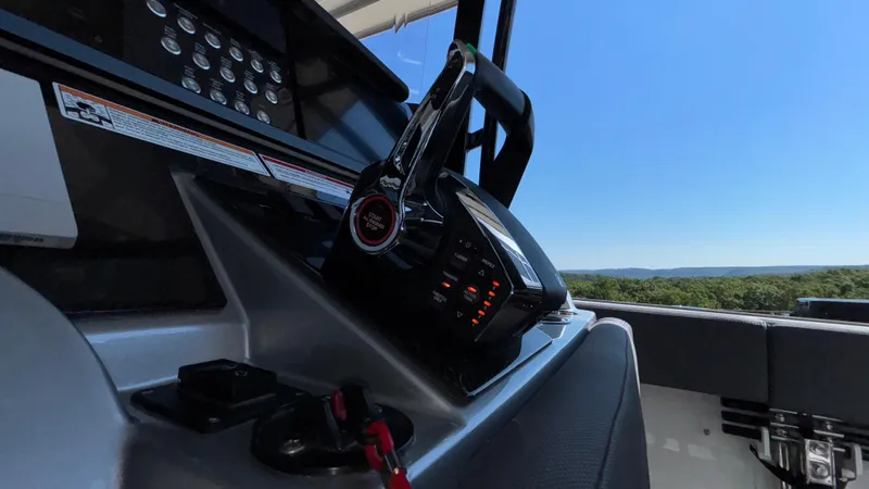  Yacht Photos Pics Control panel of 2025 Fountain 34 SC boat with scenic view.