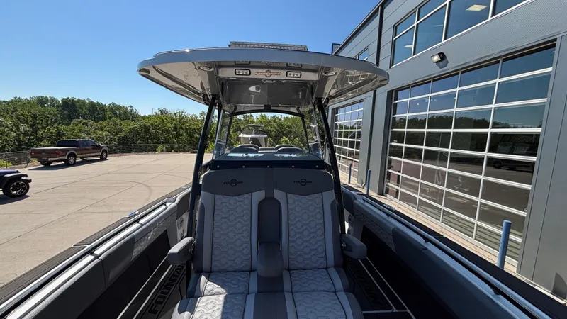  Yacht Photos Pics 2025 Fountain 34 SC boat interior with modern seating and sleek design.