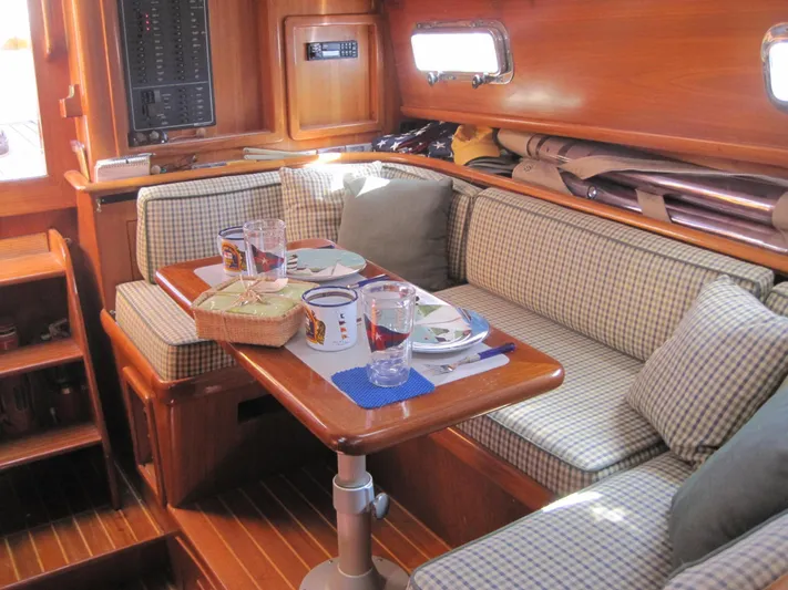  Yacht Photos Pics Cozy interior of 1990 Little Harbor Express 36 yacht with dining setup.