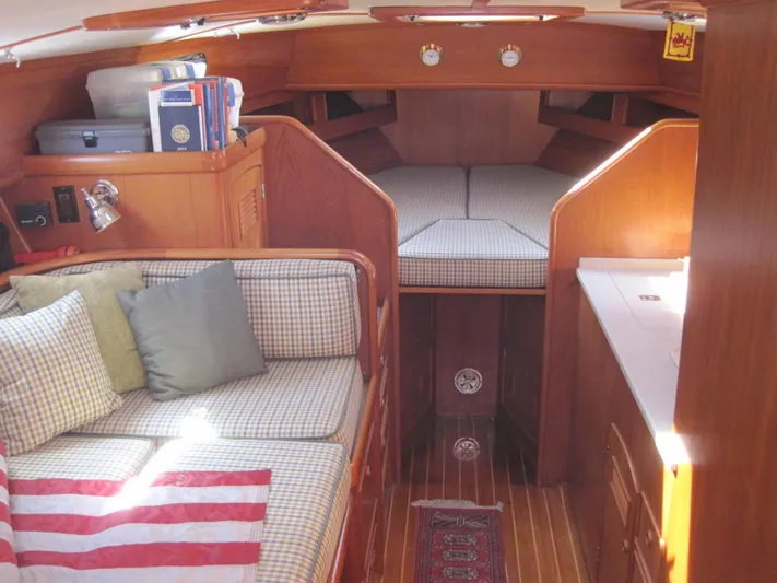  Yacht Photos Pics Interior of 1990 Little Harbor Express 36 yacht with cozy seating and wooden finishes.