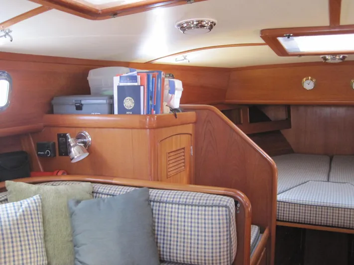  Yacht Photos Pics Interior of 1990 Little Harbor Express 36 yacht with cozy seating and wooden finish.