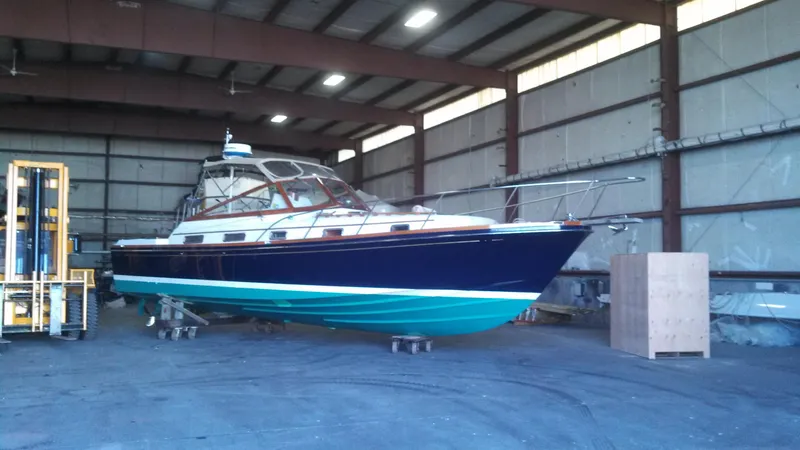  Yacht Photos Pics 1990 Little Harbor Express 36 boat in a warehouse, alongside a forklift.