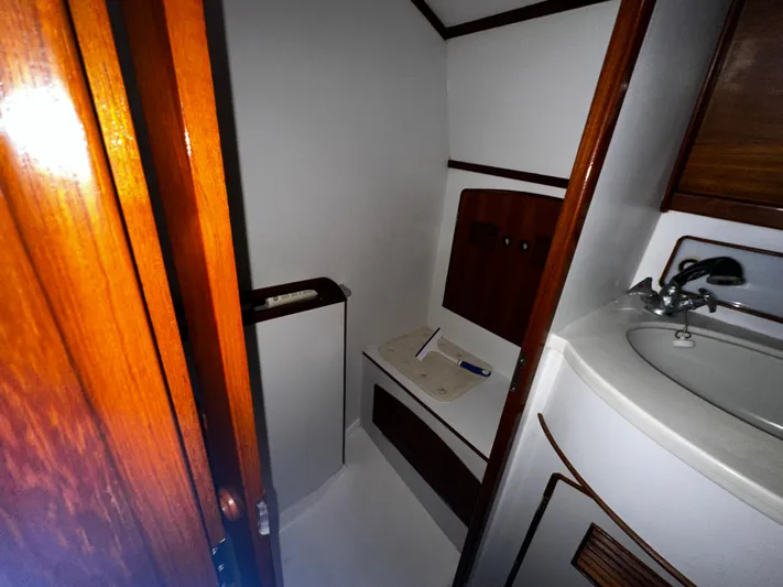  Yacht Photos Pics Interior of 1990 Little Harbor Express 36 yacht bathroom with wooden accents and sink.